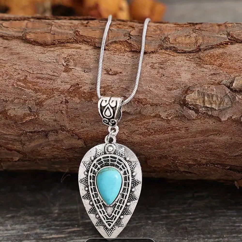 - Necklace silver with pendant.